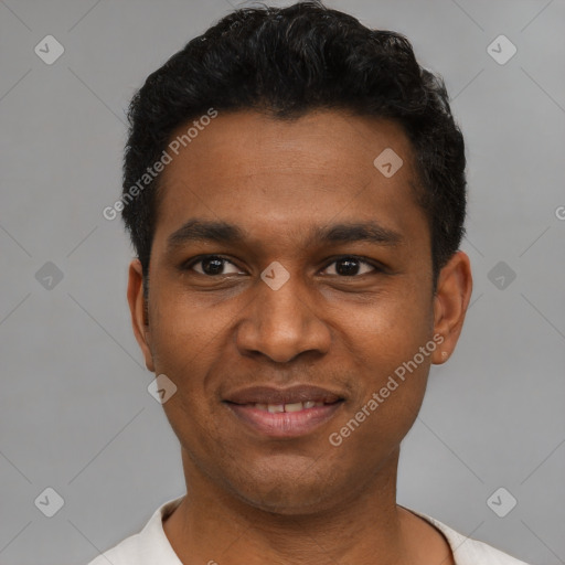Joyful latino young-adult male with short  black hair and brown eyes