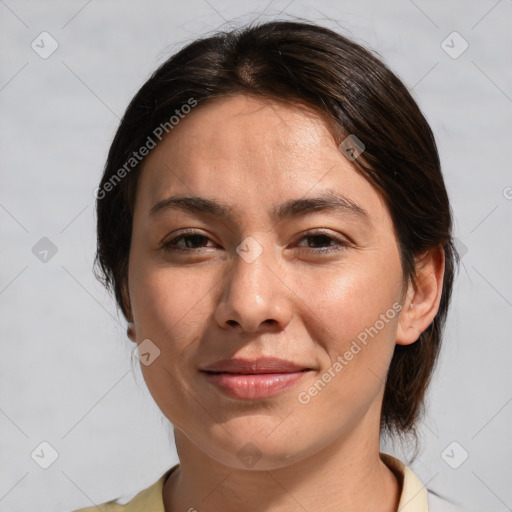 Joyful white adult female with medium  brown hair and brown eyes