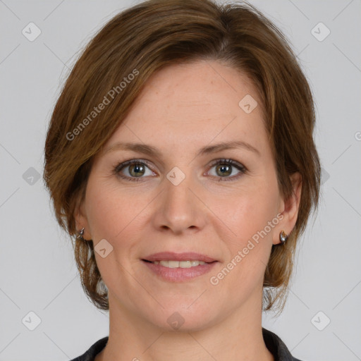 Joyful white adult female with medium  brown hair and grey eyes