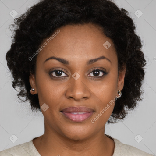 Joyful black adult female with medium  brown hair and brown eyes