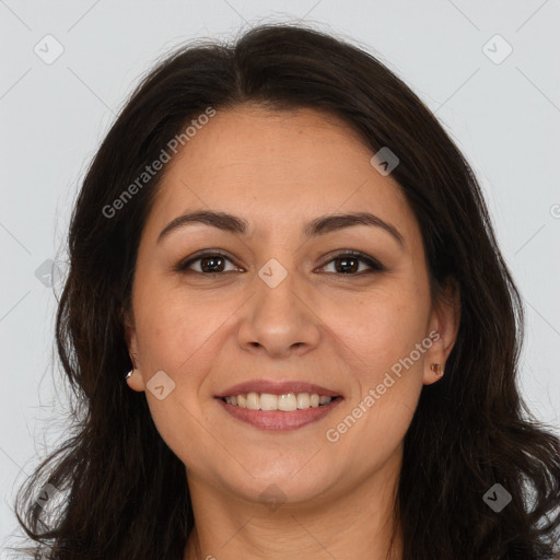 Joyful white adult female with long  brown hair and brown eyes