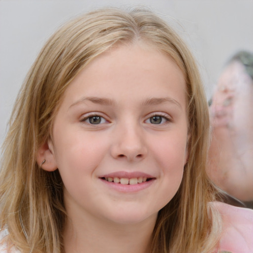 Joyful white child female with medium  brown hair and blue eyes