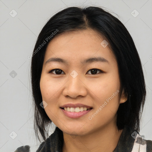 Joyful asian young-adult female with medium  black hair and brown eyes