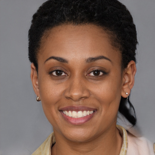 Joyful latino young-adult female with short  brown hair and brown eyes