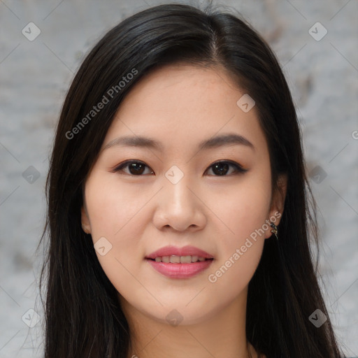 Joyful asian young-adult female with long  brown hair and brown eyes