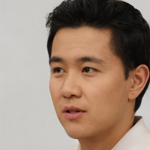 Neutral asian young-adult male with short  black hair and brown eyes