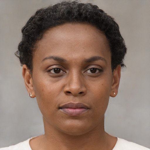 Neutral black young-adult female with short  brown hair and brown eyes