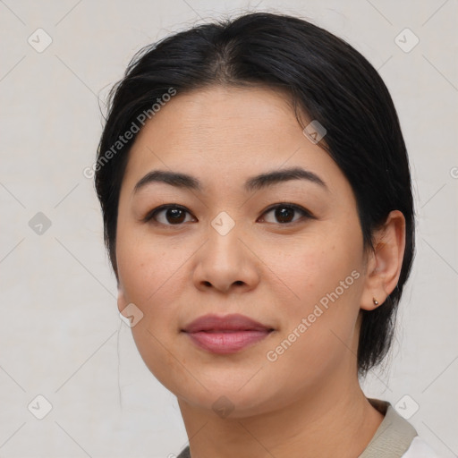 Joyful asian young-adult female with medium  black hair and brown eyes