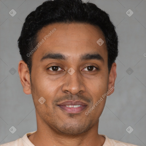 Joyful latino young-adult male with short  black hair and brown eyes