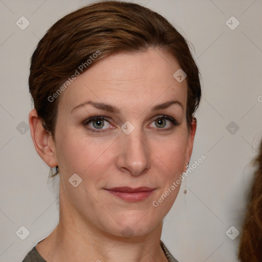 Joyful white young-adult female with medium  brown hair and blue eyes