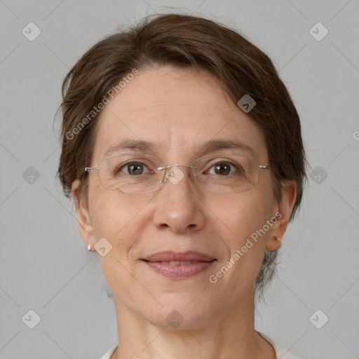 Joyful white adult female with medium  brown hair and grey eyes