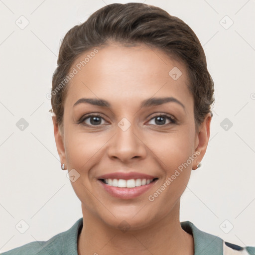 Joyful white young-adult female with short  brown hair and brown eyes