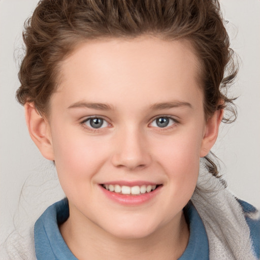 Joyful white child female with short  brown hair and grey eyes