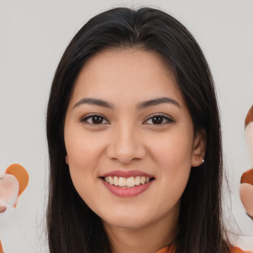 Joyful asian young-adult female with long  brown hair and brown eyes
