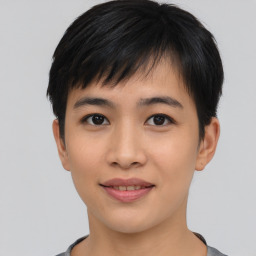 Joyful asian young-adult female with short  black hair and brown eyes