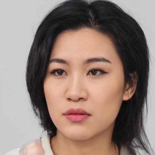 Neutral asian young-adult female with medium  brown hair and brown eyes