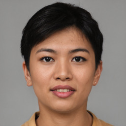 Joyful asian young-adult female with short  black hair and brown eyes