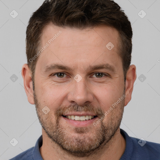 Joyful white adult male with short  brown hair and brown eyes