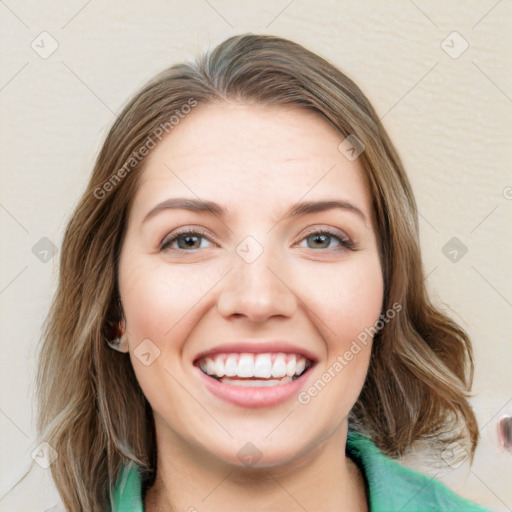 Joyful white young-adult female with medium  brown hair and green eyes