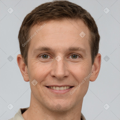 Joyful white adult male with short  brown hair and grey eyes