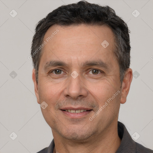 Joyful white adult male with short  brown hair and brown eyes