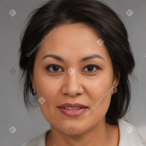 Joyful asian adult female with medium  brown hair and brown eyes