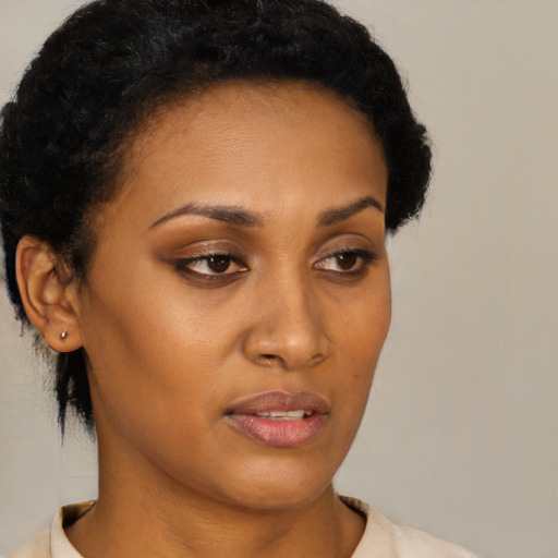 Neutral black young-adult female with short  brown hair and brown eyes