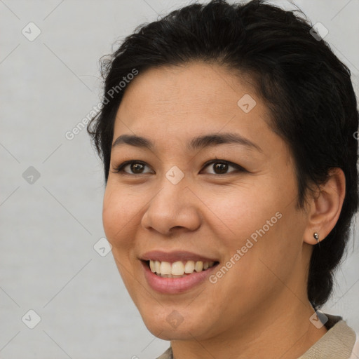 Joyful asian young-adult female with short  brown hair and brown eyes