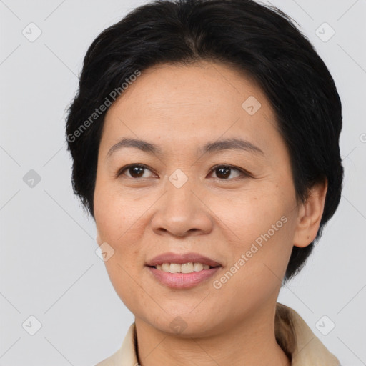 Joyful asian adult female with medium  brown hair and brown eyes