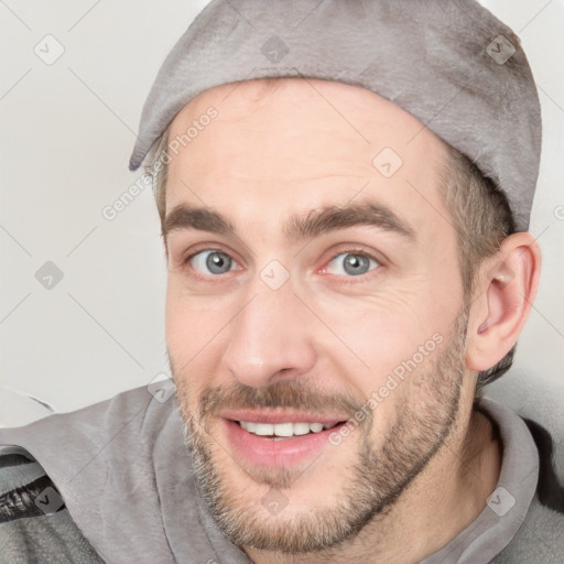 Joyful white young-adult male with short  black hair and brown eyes