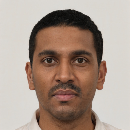 Neutral black young-adult male with short  black hair and brown eyes