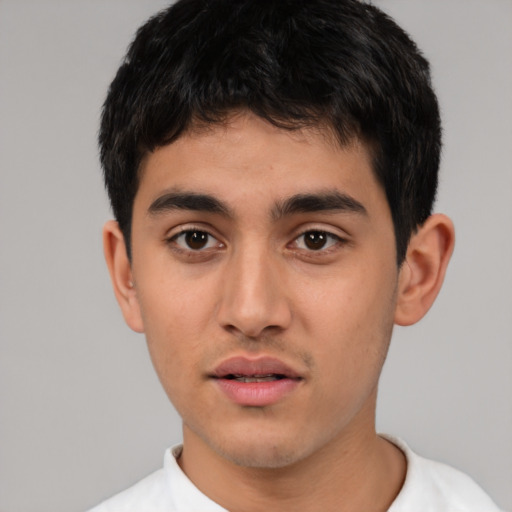 Neutral white young-adult male with short  black hair and brown eyes