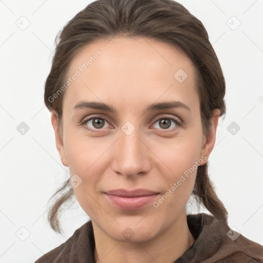 Joyful white young-adult female with medium  brown hair and grey eyes