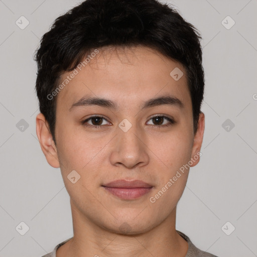 Joyful asian young-adult male with short  brown hair and brown eyes