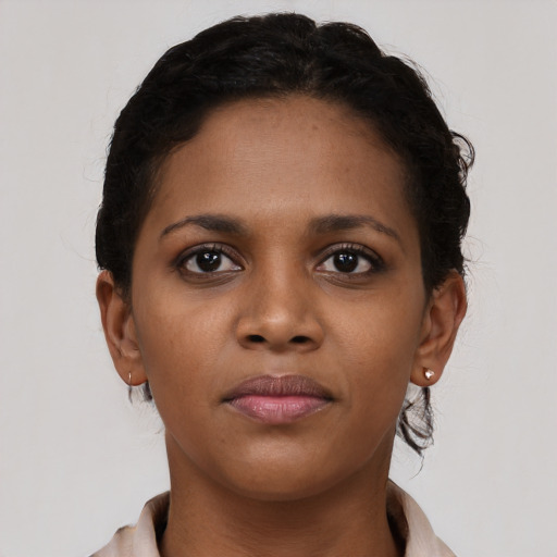 Neutral black young-adult female with short  brown hair and brown eyes