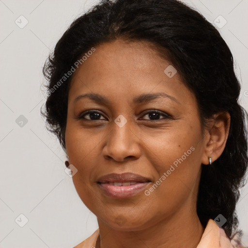 Joyful latino adult female with medium  brown hair and brown eyes