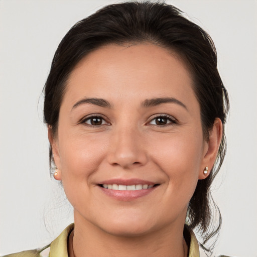 Joyful white young-adult female with medium  brown hair and brown eyes