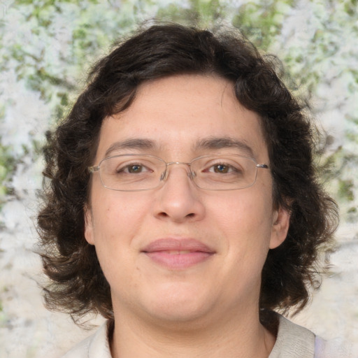 Joyful white adult male with medium  brown hair and brown eyes