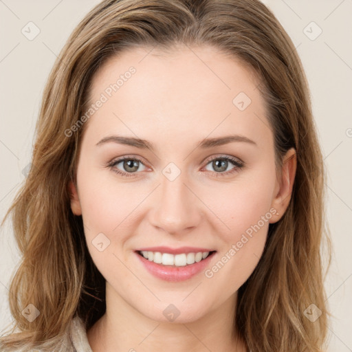 Joyful white young-adult female with long  brown hair and green eyes