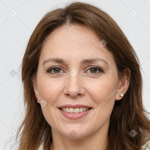 Joyful white adult female with long  brown hair and grey eyes