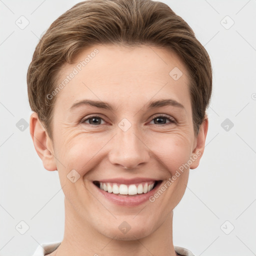 Joyful white young-adult female with short  brown hair and grey eyes