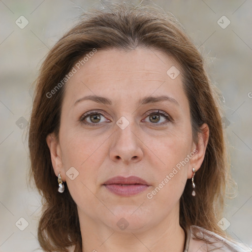 Joyful white adult female with medium  brown hair and grey eyes