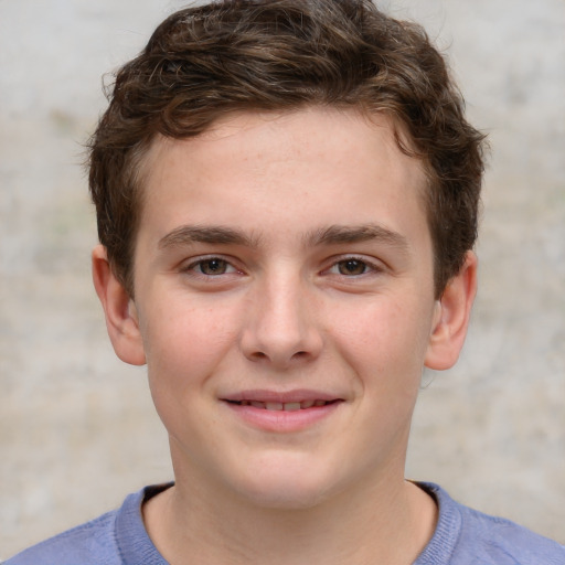 Joyful white child male with short  brown hair and grey eyes