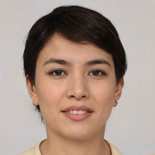 Joyful white young-adult female with short  brown hair and brown eyes