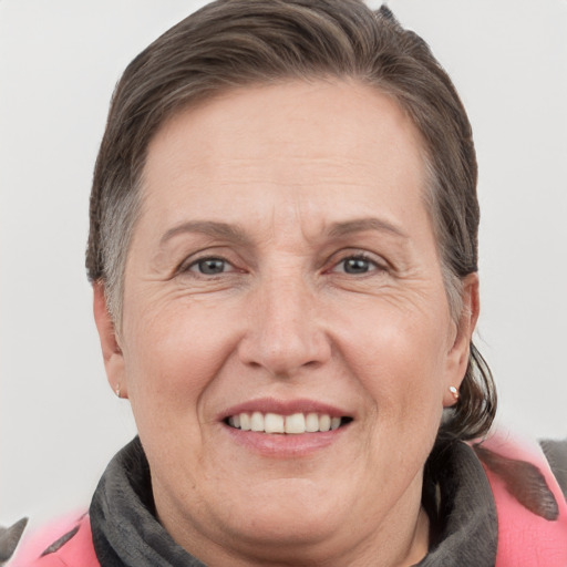 Joyful white adult female with short  brown hair and grey eyes