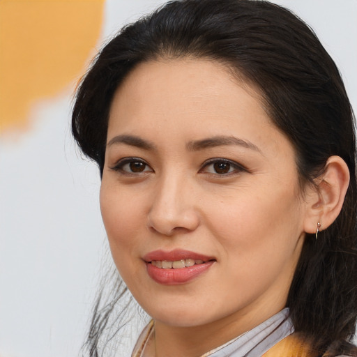 Joyful latino young-adult female with medium  brown hair and brown eyes
