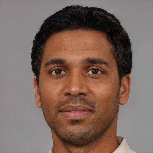 Neutral black young-adult male with short  black hair and brown eyes