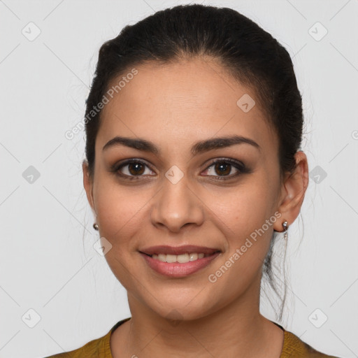 Joyful latino young-adult female with long  brown hair and brown eyes