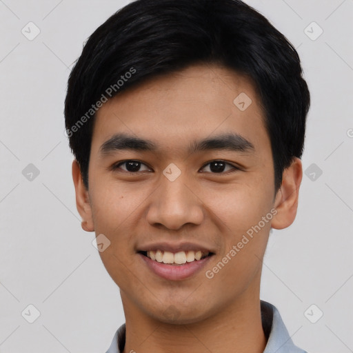 Joyful asian young-adult male with short  black hair and brown eyes