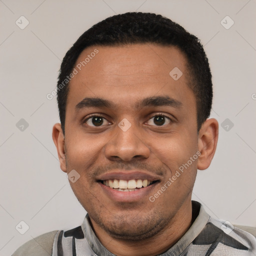 Joyful latino young-adult male with short  black hair and brown eyes